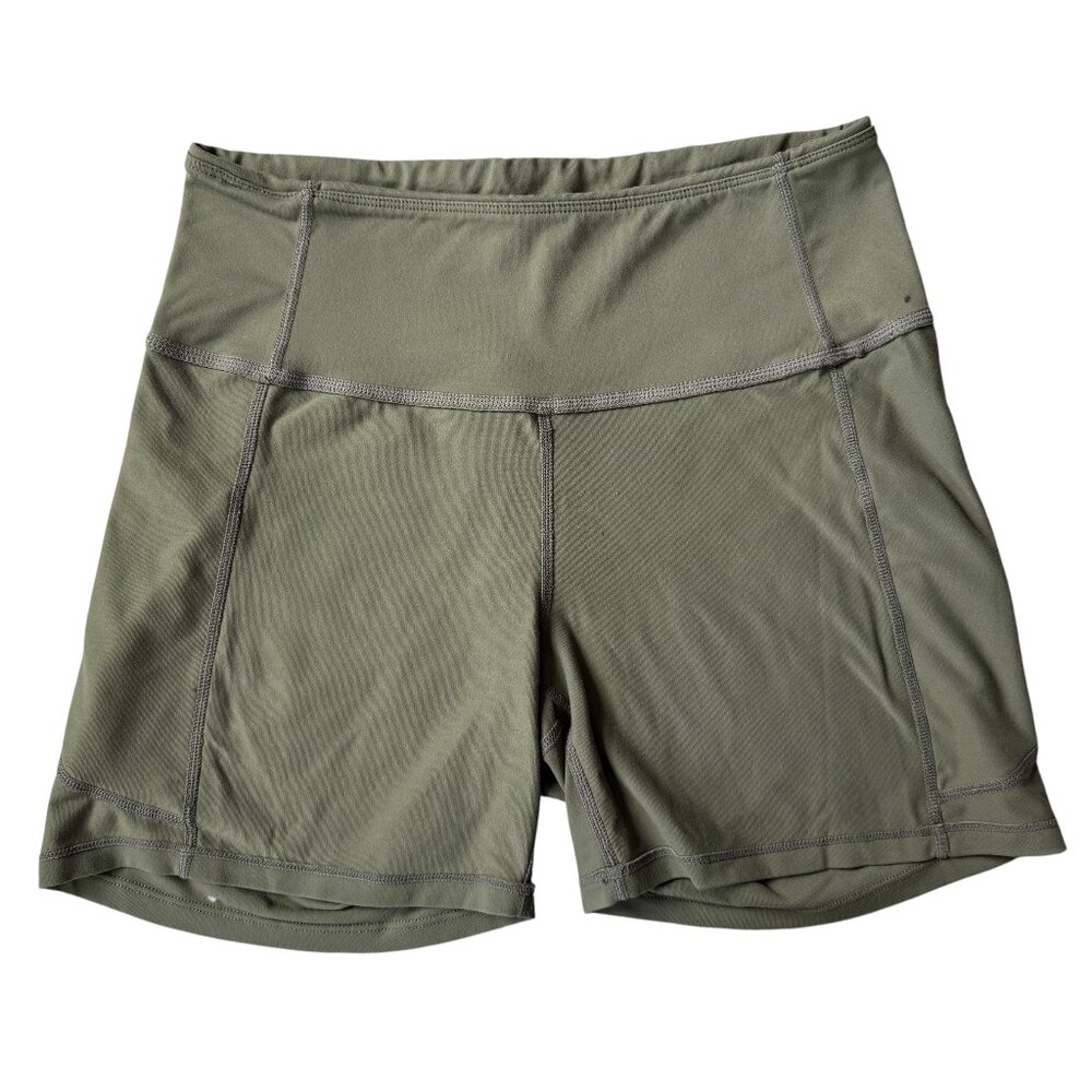 Women's olive green stretchy compression bike style shorts inside pockets
